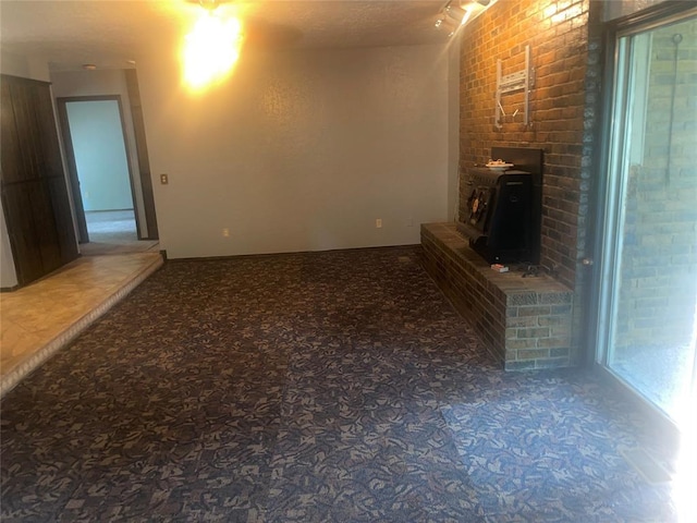 unfurnished living room with carpet flooring