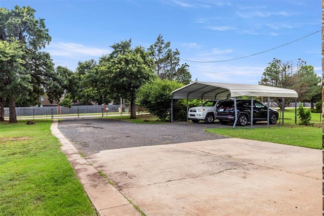 901 E Covell Rd, Edmond, OK 73034 - view of parking with driveway and a carport