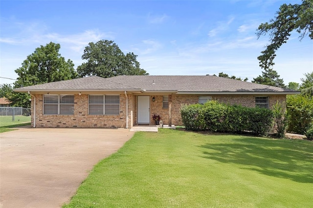 901 E Covell Rd, Edmond, OK 73034 - ranch-style house featuring driveway, brick siding, and roof with shingles