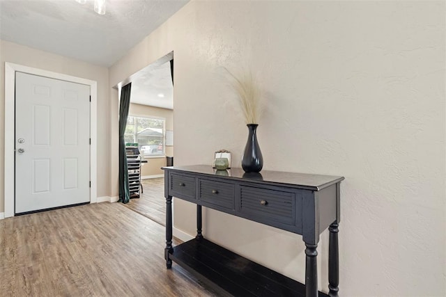 901 E Covell Rd, Edmond, OK 73034 - entryway with wood finished floors and baseboards