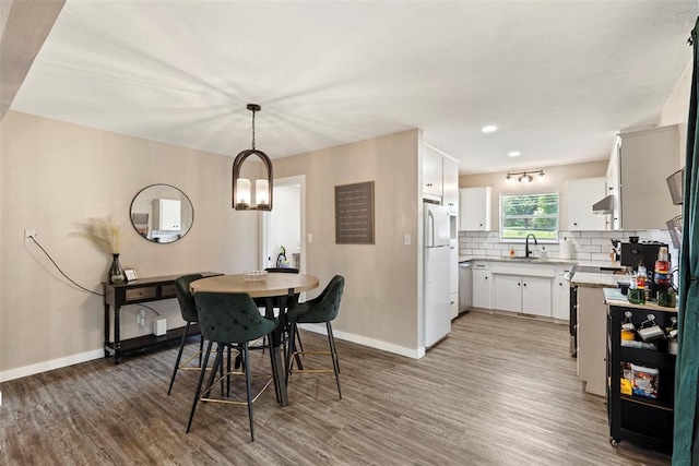 901 E Covell Rd, Edmond, OK 73034 - dining space featuring wood finished floors