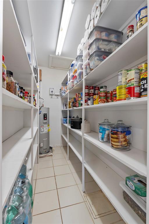 901 E Covell Rd, Edmond, OK 73034 - storage area with electric water heater