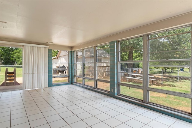 901 E Covell Rd, Edmond, OK 73034 - unfurnished sunroom featuring tile patterned floors