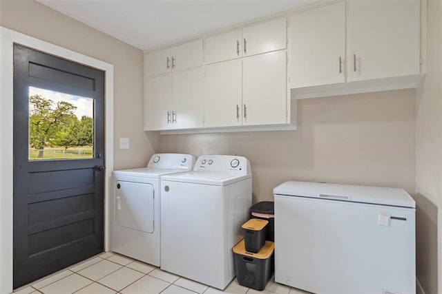 901 E Covell Rd, Edmond, OK 73034 - washroom with washing machine and dryer, cabinet space, and light tile patterned floors