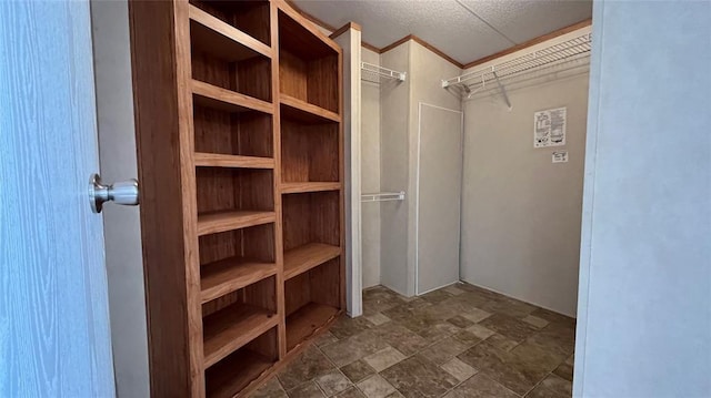 1500 S Pine Cir, Guthrie, OK 73044 - spacious closet featuring stone finish flooring