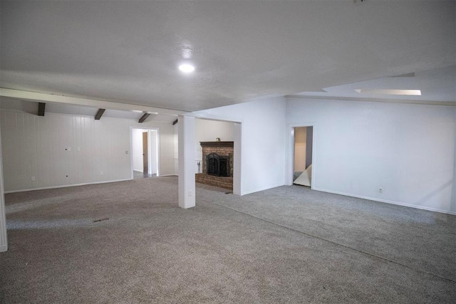 2328 NW 113th St, Oklahoma City, OK 73120 - unfurnished living room featuring a fireplace, carpet flooring, and vaulted ceiling