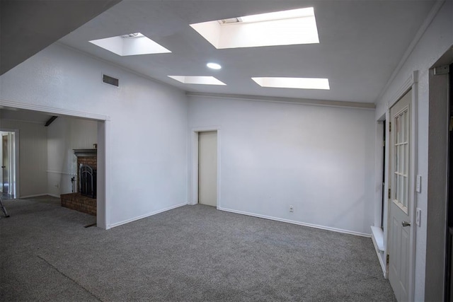 2328 NW 113th St, Oklahoma City, OK 73120 - carpeted empty room with a skylight, a fireplace, and lofted ceiling
