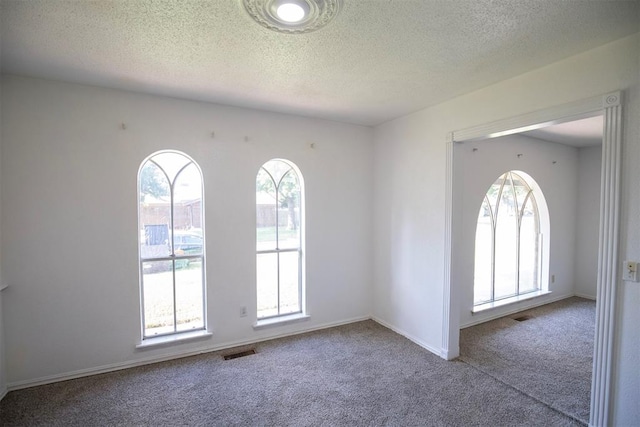 2328 NW 113th St, Oklahoma City, OK 73120 - empty room with carpet floors and a textured ceiling