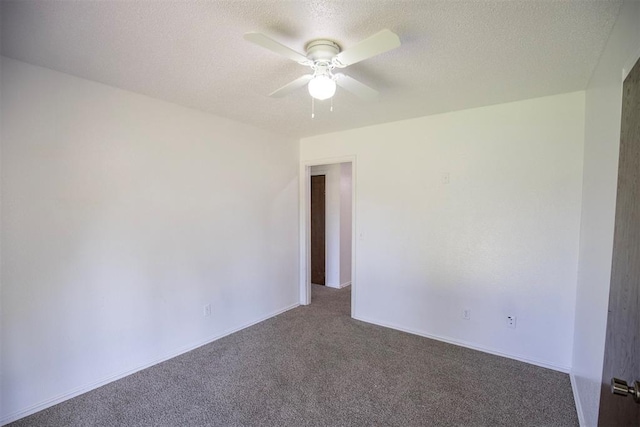 2328 NW 113th St, Oklahoma City, OK 73120 - empty room featuring dark carpet, ceiling fan, and a textured ceiling