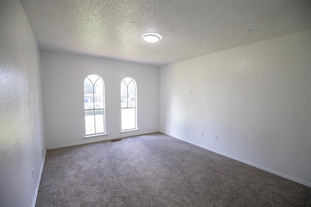 2328 NW 113th St, Oklahoma City, OK 73120 - empty room featuring carpet floors and a textured ceiling