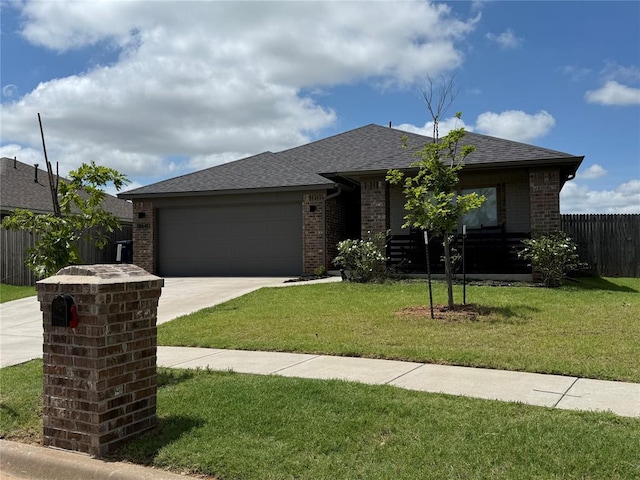 18641 Como Dr, Edmond, OK 73012 - view of front of house featuring brick siding, concrete driveway, an attached garage, and a shingled roof