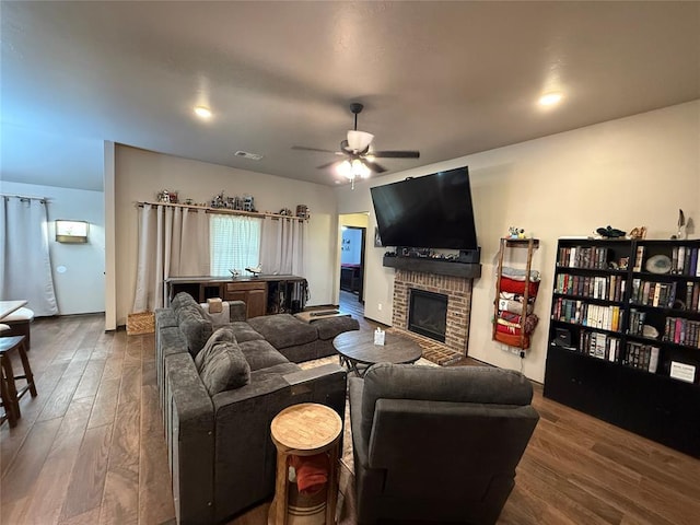 18641 Como Dr, Edmond, OK 73012 - living room featuring a fireplace, wood finished floors, and a ceiling fan