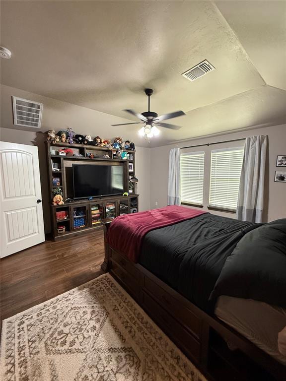18641 Como Dr, Edmond, OK 73012 - bedroom with dark wood-style flooring and a ceiling fan