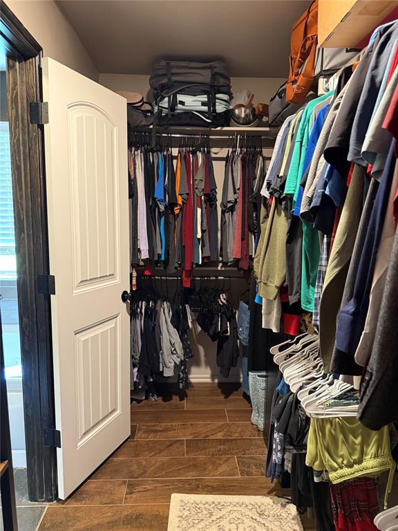 18641 Como Dr, Edmond, OK 73012 - spacious closet featuring wood finished floors