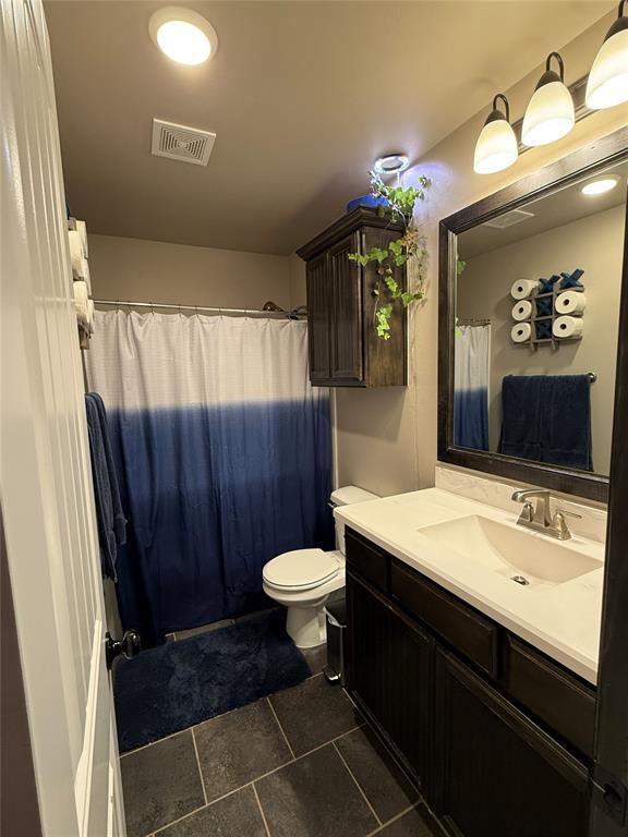 18641 Como Dr, Edmond, OK 73012 - bathroom with vanity, tile patterned floors, and a shower with shower curtain
