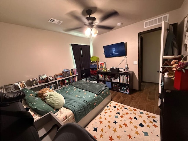 18641 Como Dr, Edmond, OK 73012 - bedroom with wood finished floors and a ceiling fan