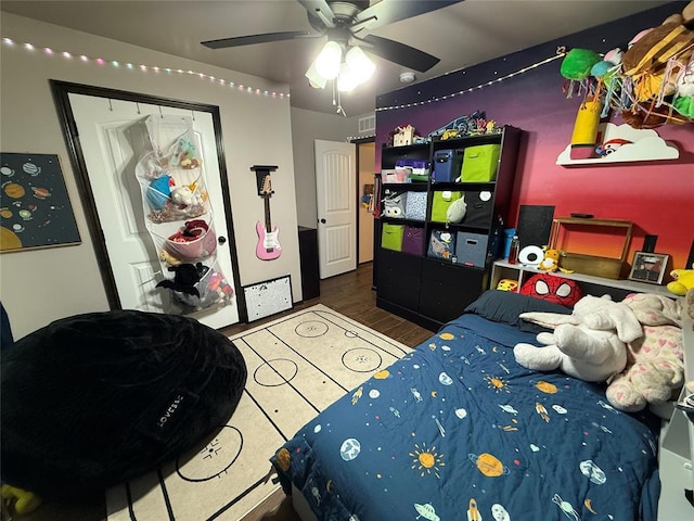 18641 Como Dr, Edmond, OK 73012 - bedroom with wood finished floors and a ceiling fan