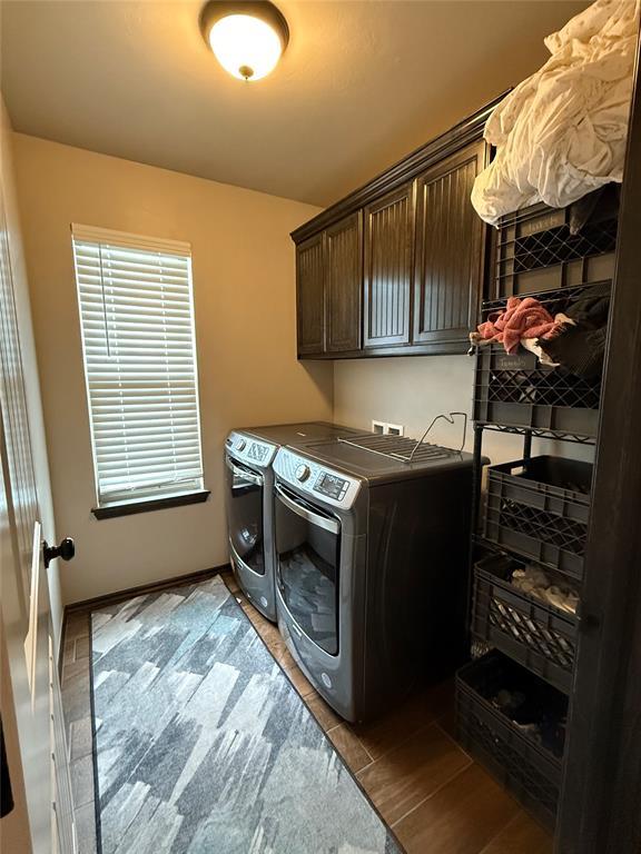 18641 Como Dr, Edmond, OK 73012 - laundry area with washer and clothes dryer and cabinet space