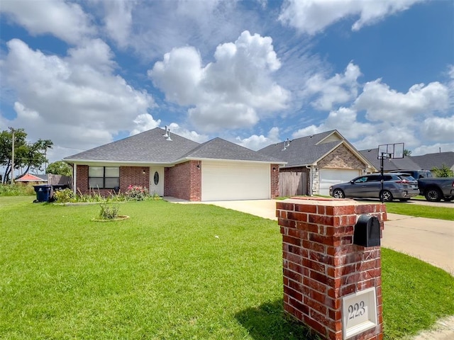 223 SE 53rd St, Oklahoma City, OK 73129 - ranch-style home featuring a garage, driveway, a front yard, and brick siding