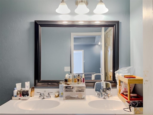 223 SE 53rd St, Oklahoma City, OK 73129 - bathroom featuring double vanity and a textured wall