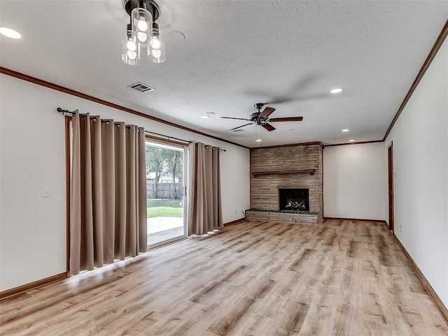 4325 NW 44th St, Oklahoma City, OK 73112 - unfurnished living room featuring ornamental molding, ceiling fan, light wood-type flooring, a textured ceiling, and recessed lighting