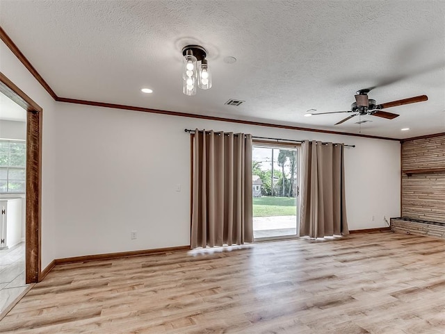 4325 NW 44th St, Oklahoma City, OK 73112 - empty room featuring crown molding, plenty of natural light, a textured ceiling, light wood-style floors, and ceiling fan