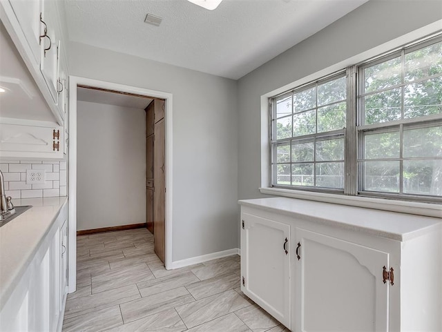 4325 NW 44th St, Oklahoma City, OK 73112 - corridor with baseboards and a sink