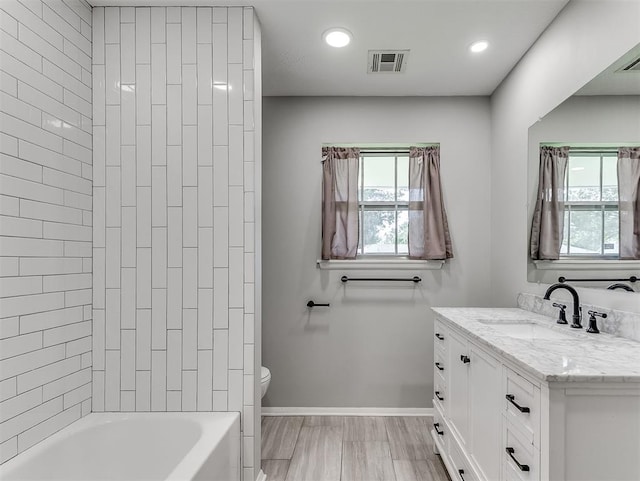 4325 NW 44th St, Oklahoma City, OK 73112 - bathroom featuring vanity, healthy amount of natural light, recessed lighting, and tub / shower combination