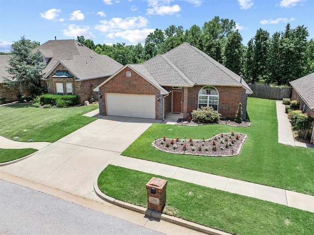 1204 NW 190th Pl, Edmond, OK 73012 - view of front of property with an attached garage, driveway, a shingled roof, and brick siding