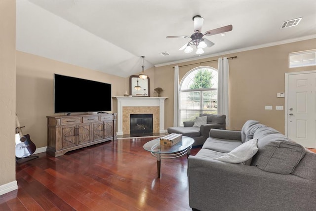 1204 NW 190th Pl, Edmond, OK 73012 - living room featuring a ceiling fan, wood finished floors, crown molding, a tile fireplace, and lofted ceiling