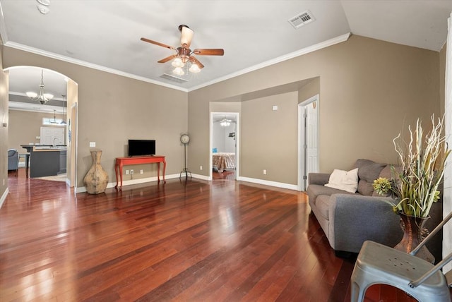 1204 NW 190th Pl, Edmond, OK 73012 - living room featuring ceiling fan, hardwood / wood-style flooring, arched walkways, and crown molding