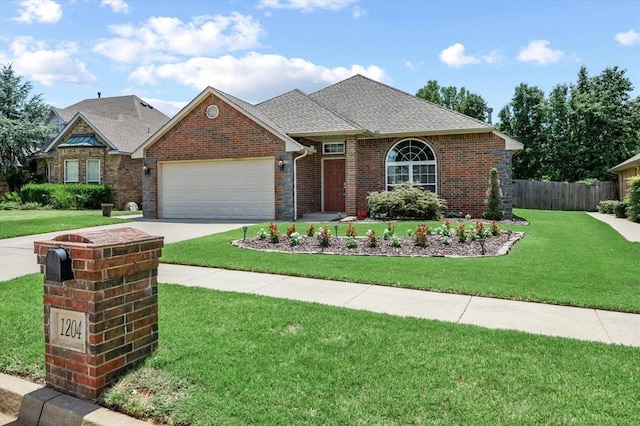 1204 NW 190th Pl, Edmond, OK 73012 - view of front facade featuring a garage, driveway, roof with shingles, and brick siding