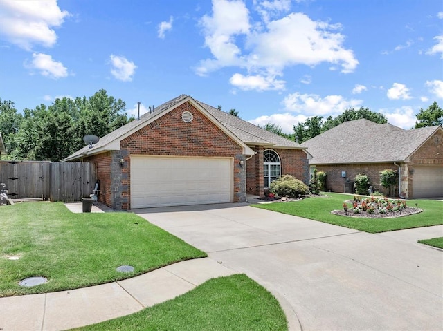 1204 NW 190th Pl, Edmond, OK 73012 - single story home featuring an attached garage, driveway, brick siding, and a gate