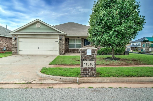 11516 SW 24th St, Yukon, OK 73099 - view of front of property with an attached garage, driveway, brick siding, and a front lawn