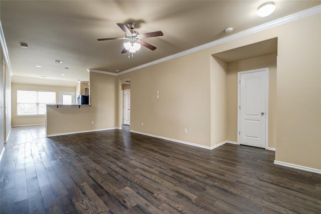 11516 SW 24th St, Yukon, OK 73099 - unfurnished living room with a ceiling fan, dark wood finished floors, and crown molding