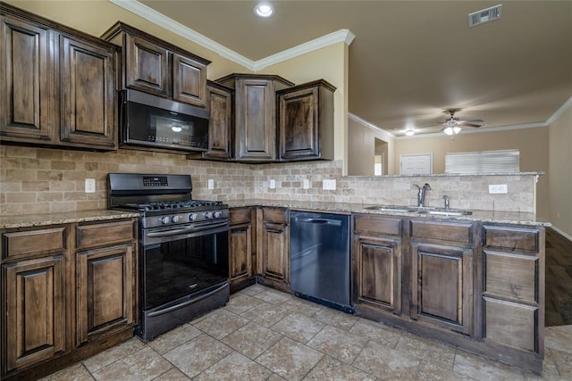 11516 SW 24th St, Yukon, OK 73099 - kitchen featuring stainless steel appliances, ceiling fan, crown molding, decorative backsplash, and light stone counters