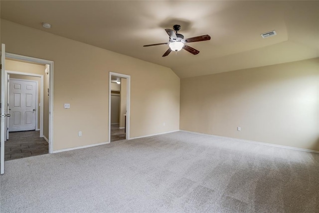11516 SW 24th St, Yukon, OK 73099 - unfurnished bedroom with carpet floors, a spacious closet, a ceiling fan, and lofted ceiling