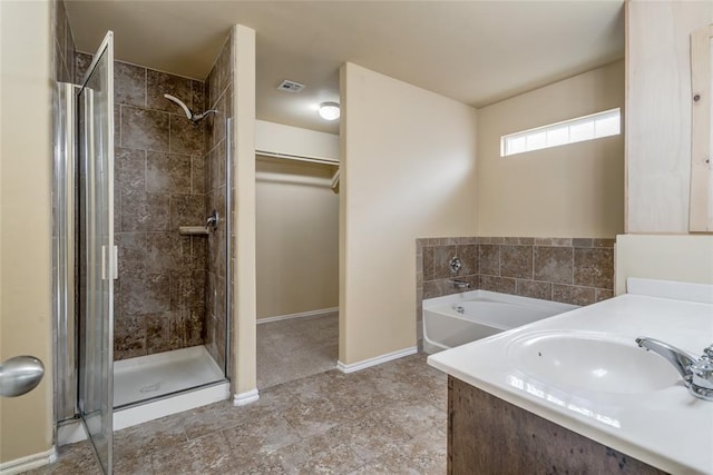 11516 SW 24th St, Yukon, OK 73099 - full bath featuring a garden tub, a stall shower, a spacious closet, and vanity
