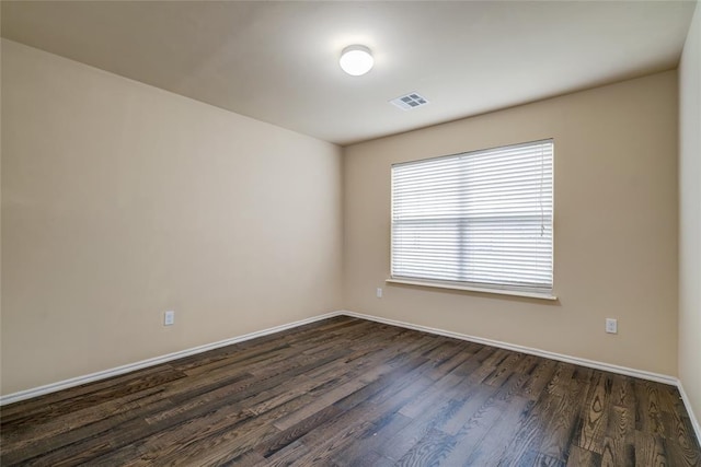 11516 SW 24th St, Yukon, OK 73099 - unfurnished room with dark wood finished floors and baseboards