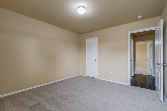 11516 SW 24th St, Yukon, OK 73099 - empty room featuring dark carpet and a smoke detector