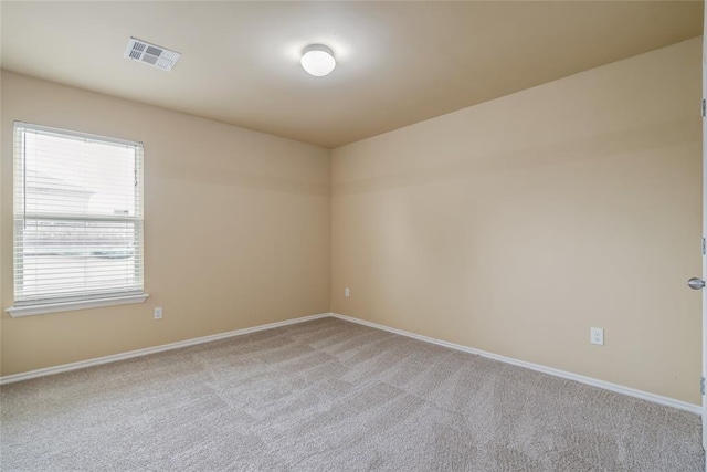 11516 SW 24th St, Yukon, OK 73099 - empty room featuring baseboards and light colored carpet