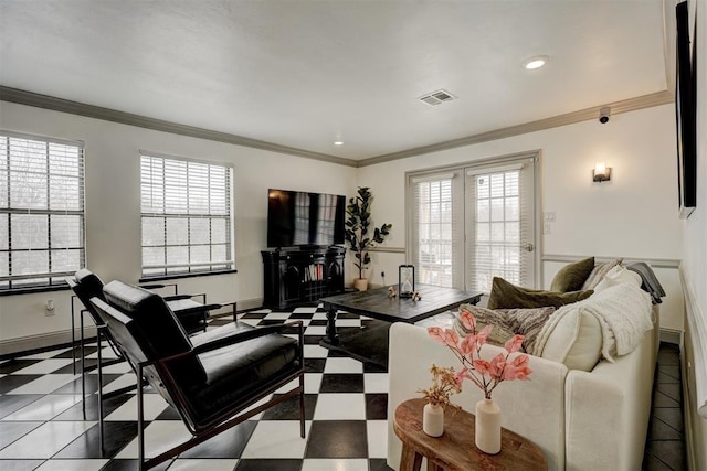 4400 Hemingway Dr Unit 259, Oklahoma City, OK 73118 - living room with tile patterned floors, plenty of natural light, and ornamental molding