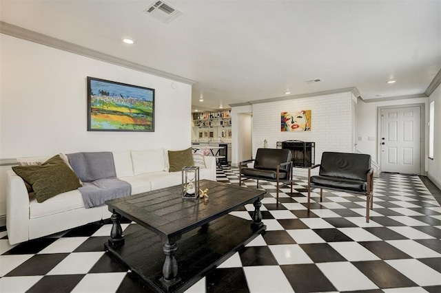 4400 Hemingway Dr Unit 259, Oklahoma City, OK 73118 - living room featuring tile patterned floors, a brick fireplace, ornamental molding, and recessed lighting