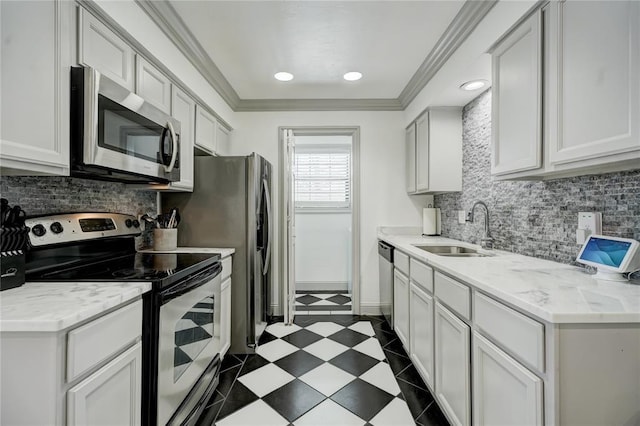 4400 Hemingway Dr Unit 259, Oklahoma City, OK 73118 - kitchen with stainless steel appliances, decorative backsplash, crown molding, white cabinetry, and recessed lighting