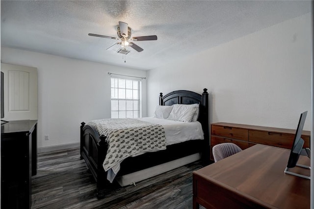 4400 Hemingway Dr Unit 259, Oklahoma City, OK 73118 - bedroom featuring dark wood finished floors, a textured ceiling, and ceiling fan