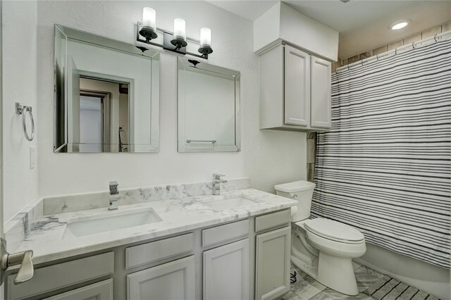 4400 Hemingway Dr Unit 259, Oklahoma City, OK 73118 - bathroom featuring double vanity and toilet