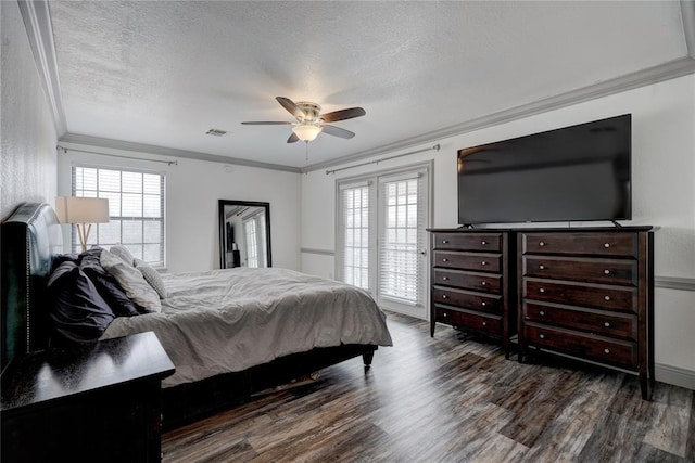 4400 Hemingway Dr Unit 259, Oklahoma City, OK 73118 - bedroom featuring ornamental molding, wood finished floors, a textured ceiling, multiple windows, and ceiling fan