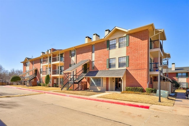 4400 Hemingway Dr Unit 259, Oklahoma City, OK 73118 - view of apartment building / complex featuring stairway