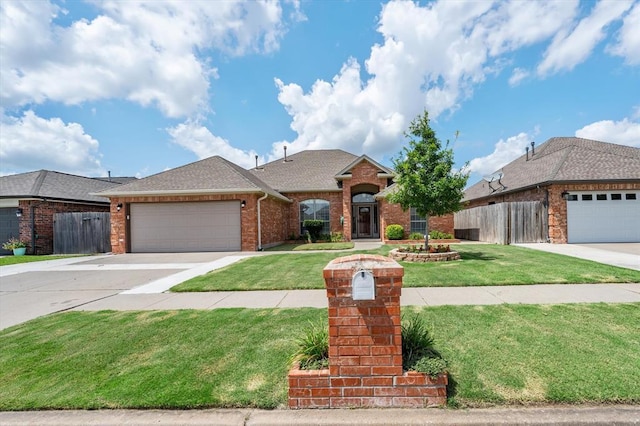 541 SW 154th Ct, Oklahoma City, OK 73170 - traditional home with brick siding, a garage, concrete driveway, and roof with shingles