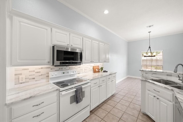 541 SW 154th Ct, Oklahoma City, OK 73170 - kitchen with appliances with stainless steel finishes, tasteful backsplash, crown molding, light tile patterned floors, and white cabinets